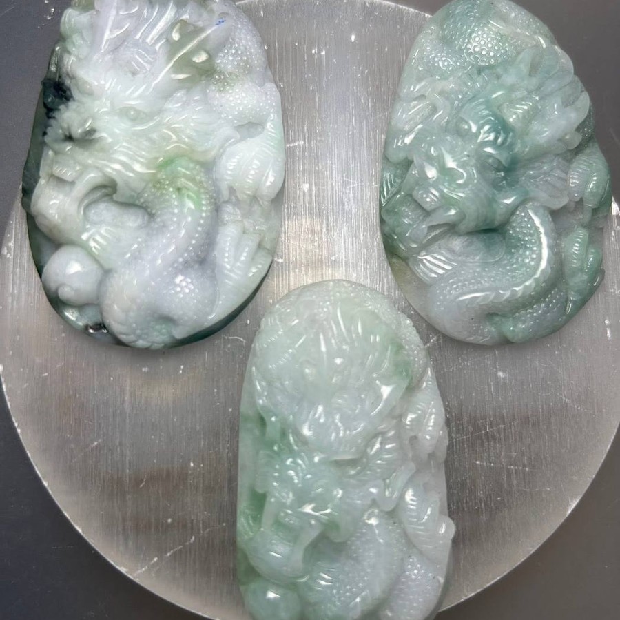 Hand carved jade dragon pendants